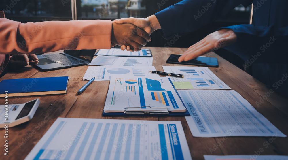 Obraz premium Business handshake for teamwork of business merger and acquisition,successful negotiate,hand shake,two businessman shake hand with partner to celebration partnership and business deal concept