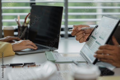 diverse team working together in modern co-working space, business people having casual discussion during meeting, marketing, accounting, finance, Team working ambitiously in an office room. photo