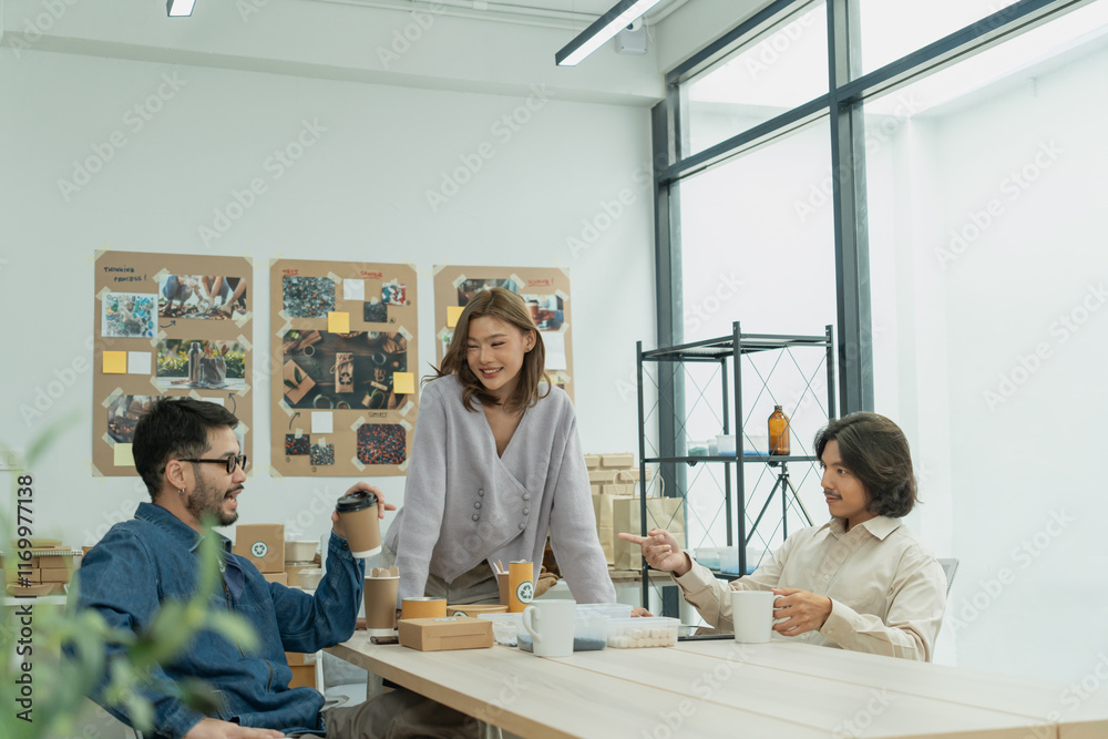 Diverse team having a casual discussion about eco-friendly product packaging in creative office space Diverse team having a casual discussion about eco-friendly product packaging in creative office space