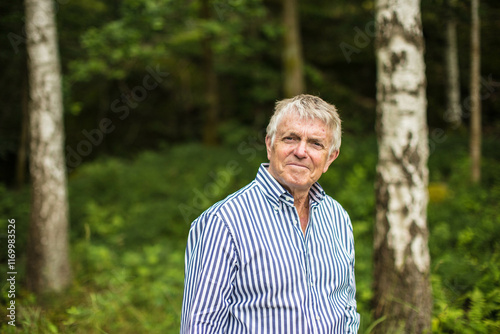 A portrait of an older Swedish man outside in the nature