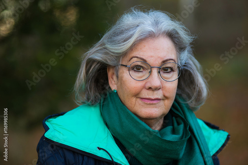 A portrait of an older Swedish woman outside in the nature