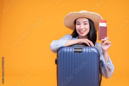 Close up traveler happy woman wears casual clothes hold passport ticket suitcase bag isolated on orange background. Tourist travel abroad in free spare time rest getaway. Air flight trip concept. #1170000312