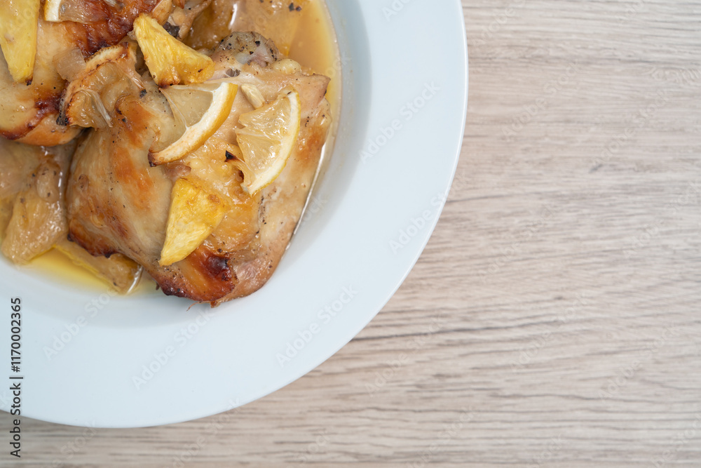 Close up, Baked chicken thighs with pineapple on wood table, Top view Close up, Baked chicken thighs with pineapple on wood table, Top view