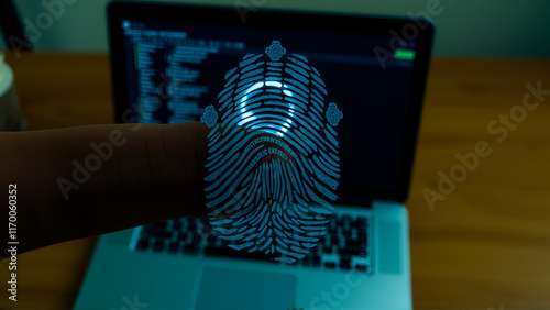 Finger print over computer on the desktop background. Top view. Double exposure. Concept of securitization. photo