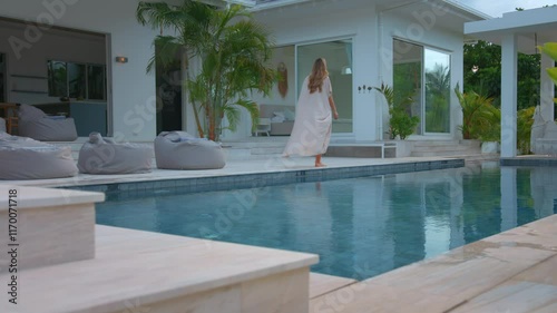 Enjoy a serene evening by the pool in a stunning modern luxury villa, ideal for relaxation