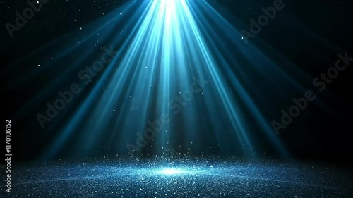 bright blue light shining down with a scattering of blue particles below