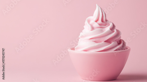 Bowl of strawberry yogurt on pink background with space for text photo