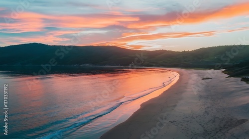 Attractive Aerial beautiful shot of a seashore with hills on the background at sunset photo