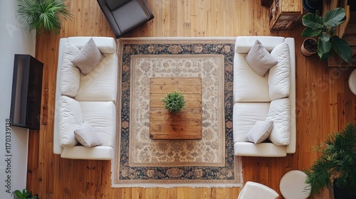 Cozy Living Room Interior Design: Overhead View of Modern Furniture Arrangement with Wooden Floor, Rug, and Sofas photo