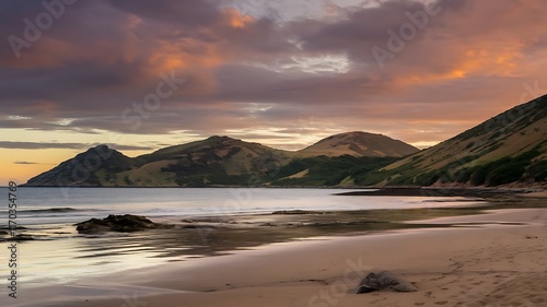 An aerial beautiful shot of a seashore with hills on the background at sunset - AI Generative