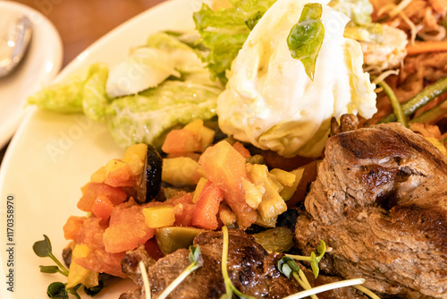 Meat and vegetable platter, Caesar salad and glass noodle salad with vegetables. photo