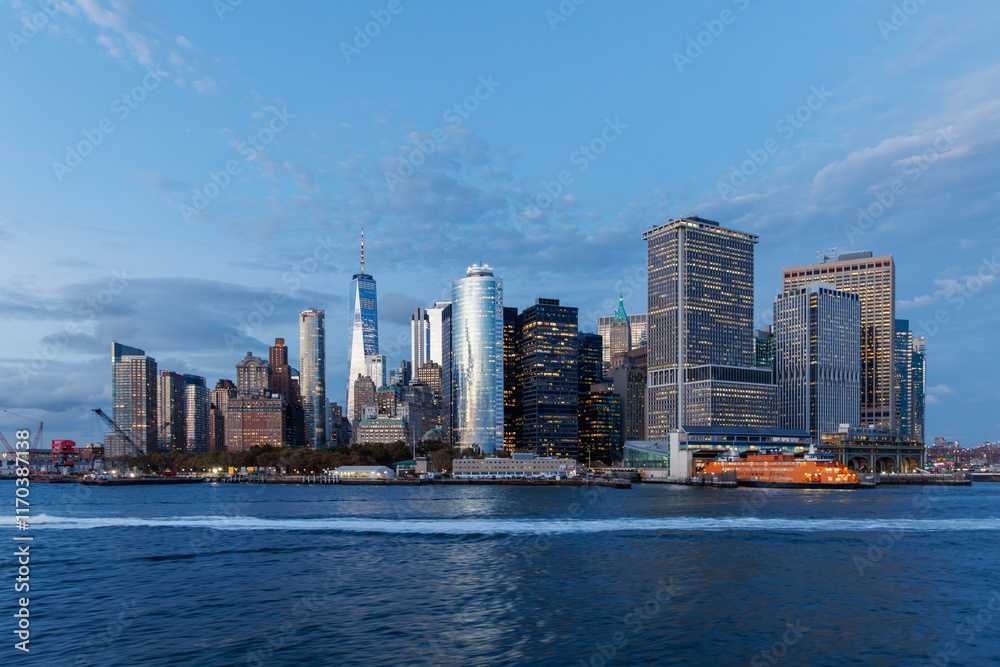 A vibrant sunset panorama of Manhattan downtown skyline, viewed from the river
