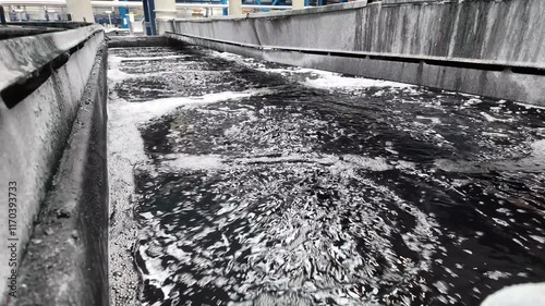 Large industrial bath for chemical treatment of metal products. Process in industrial factory