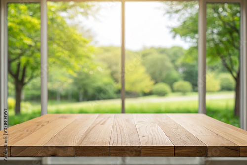 Empty of wood table top on blur of curtain with window view green from tree garden background. For montage product display or design key visual layout photo