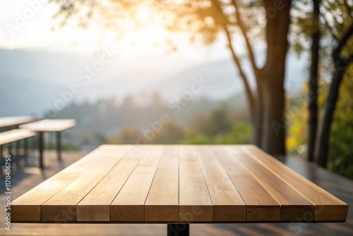Empty wooden table top front of morning light with blurred natural abstract background. can be used product display.
