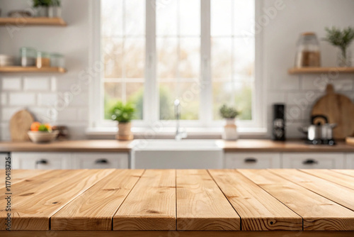 Empty wood table top on blur kitchen window background. For product or foods montage.