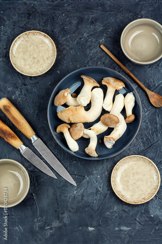 Uncooked champignon mushrooms in a bowl. photo