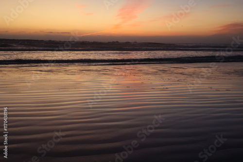 Glassy Ocean Reflecting Sunset Colors