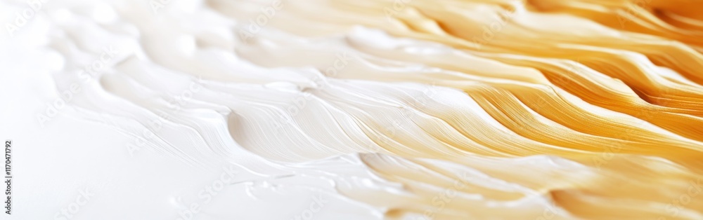 Obraz premium Swirls of white and golden hues create a captivating abstract design on a clean surface