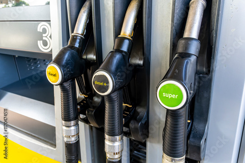 refuel station close up with three refueling dispensers of petrol and diesel on gas station. modern concept of fuel consumprion and price of fuel