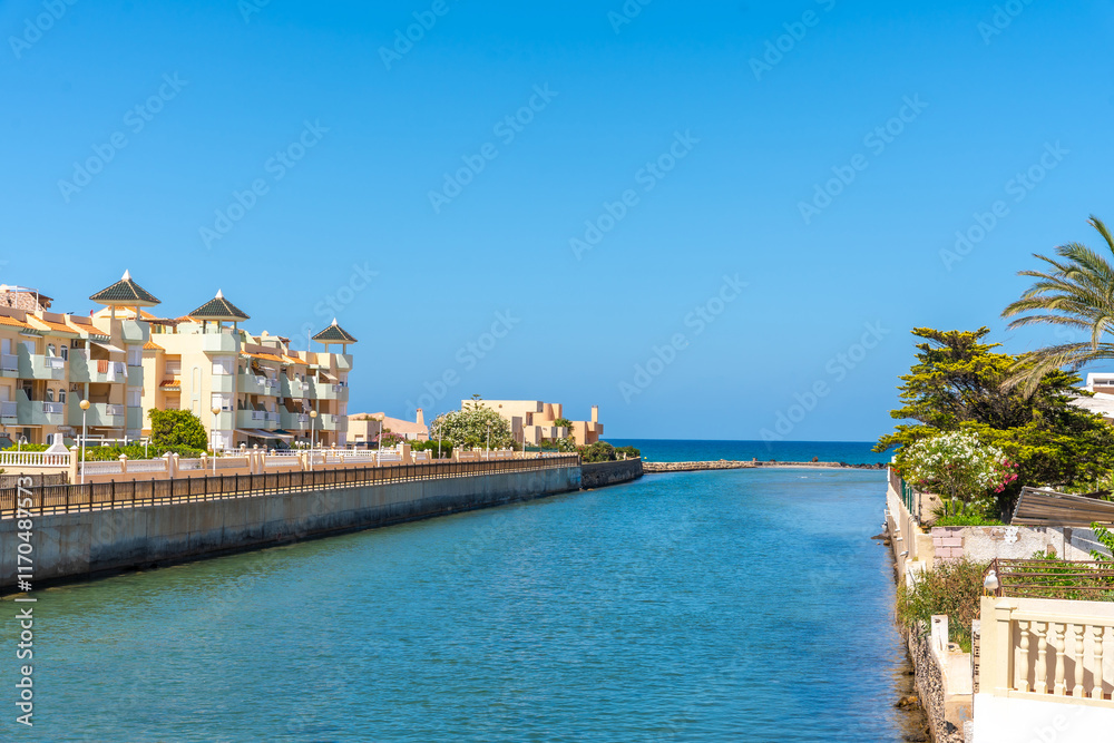 Canal flowing into the mediterranean sea at la manga, spain Canal flowing into the mediterranean sea at la manga, spain