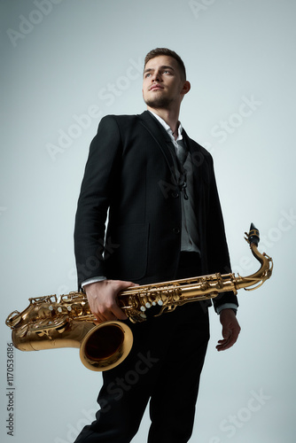 Photography saxophone player in a studio