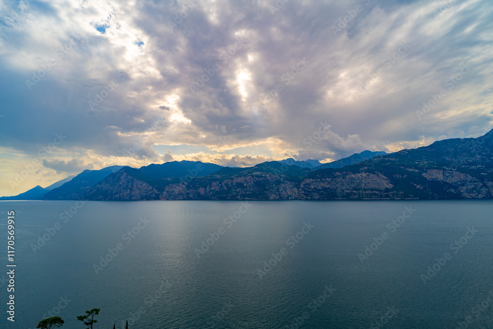 Lake and Mountain Landscape Under Dramatic Cloudy Sky Lake and Mountain Landscape Under Dramatic Cloudy Sky