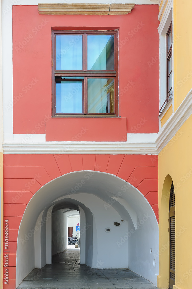 Fototapeta premium Old building facade with white tunnel in Sibiu, Romania