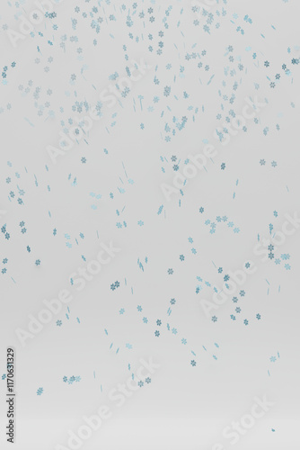 Snowflakes falling down on light background.