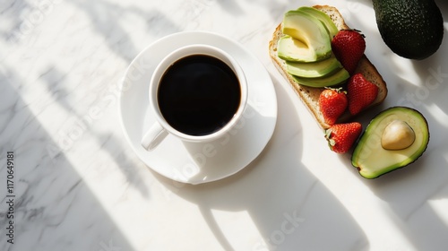 Elegant Breakfast with Coffee, Avocado, Toast, and Strawberries on Marble Surface