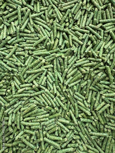 Tofu Litter Pellets in green palette. Pieces of Flushable Clumping Fast Drying Tofu Cat Ultra Absorbent Litter. Premium eco litter, soluble in water.
