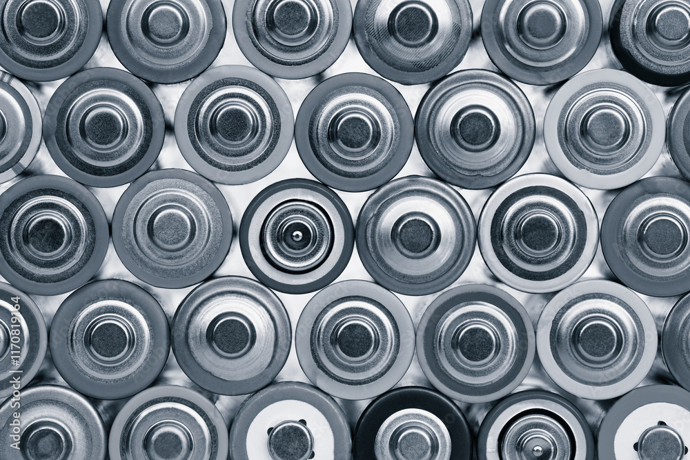 Closeup of pile of used alkaline batteries. Close up rows of selection of AA batteries energy abstract background of colorful batteries. Alkaline battery aa size. Several batteries in rows. Closeup of pile of used alkaline batteries. Close up rows of selection of AA batteries energy abstract background of colorful batteries. Alkaline battery aa size. Several batteries in rows.
