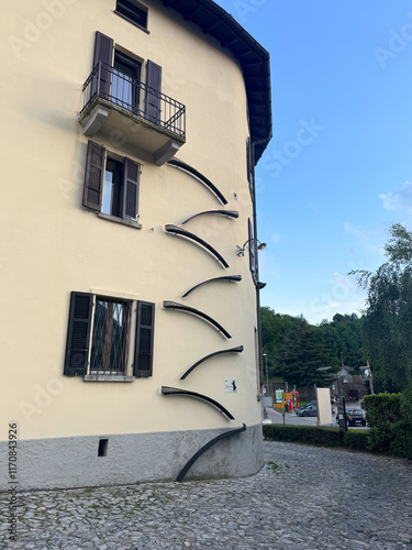 Residential building with cat ladder going up to the third floor wall on the outside on the building facade, Lugano, Switzerland photo