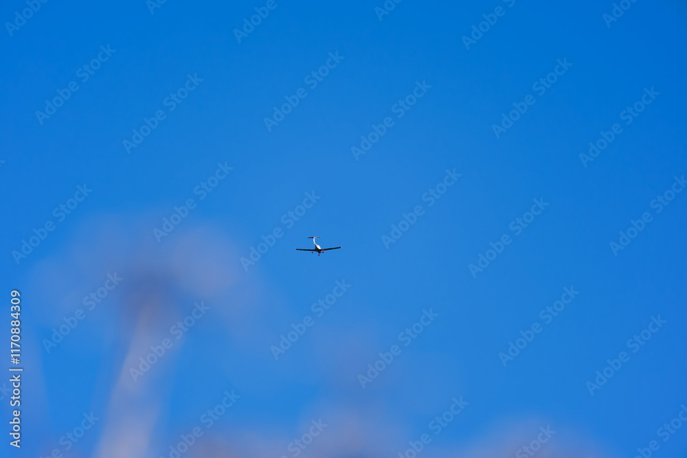 Propeller airplane up in the sky in Swiss Alps seen from mountain village of Maloja on a sunny autumn day. Photo taken November 15th, 2024, Maloja Bregaglia, Switzerland. Propeller airplane up in the sky in Swiss Alps seen from mountain village of Maloja on a sunny autumn day. Photo taken November 15th, 2024, Maloja Bregaglia, Switzerland.