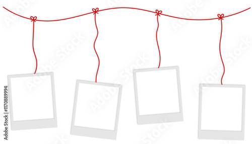 blank polaroid photo frames hanging from red string