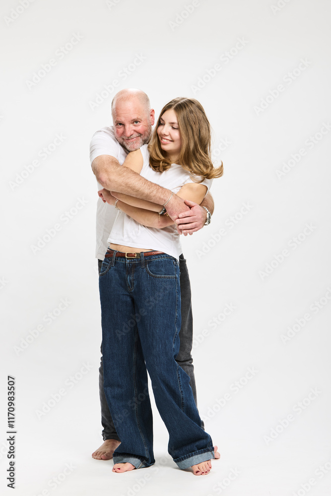 Studio portrait of father with teenager. Studio portrait of father with teenager.