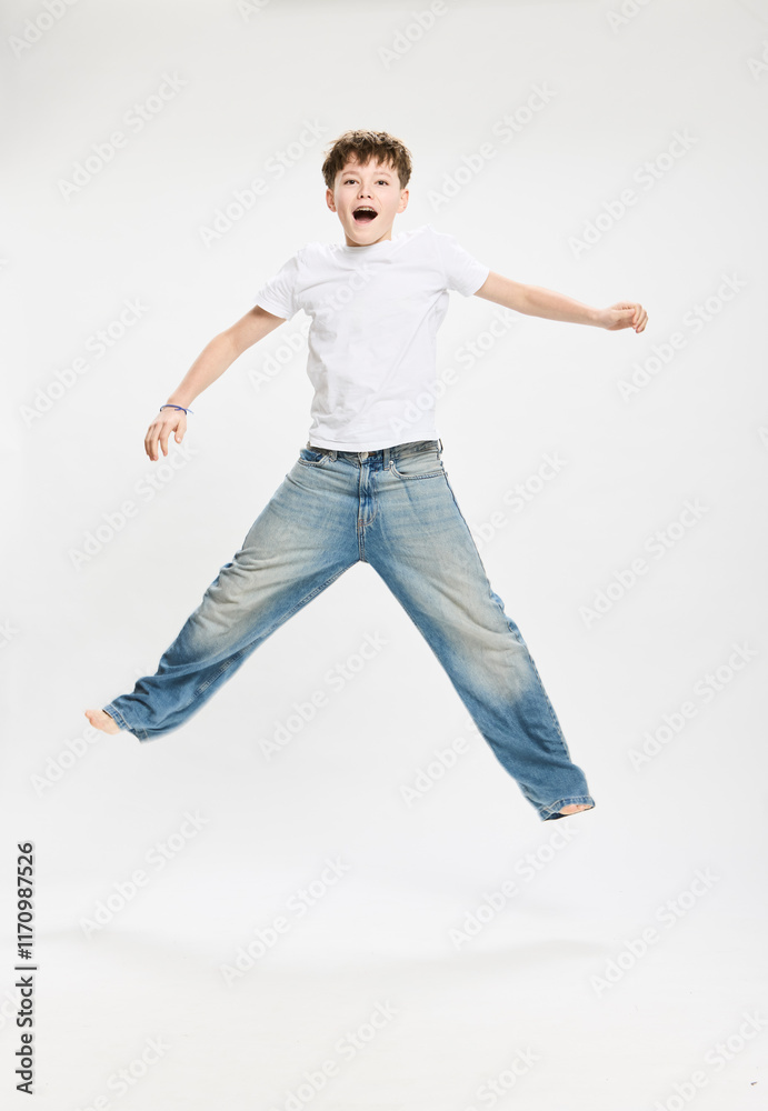 Studio portrait of teenager jumping. Studio portrait of teenager jumping.