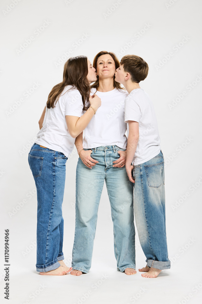 Studio portrait of mother with two teenage kids. Studio portrait of mother with two teenage kids.
