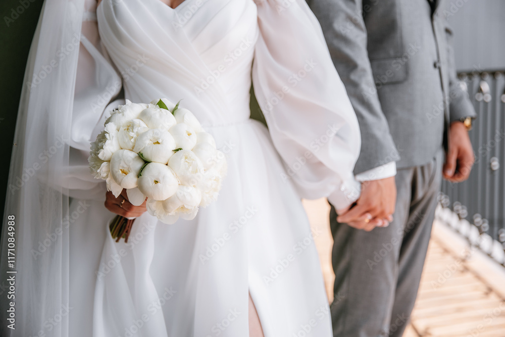 Handshake of newlyweds, top view. Wedding rings on hands Handshake of newlyweds, top view. Wedding rings on hands