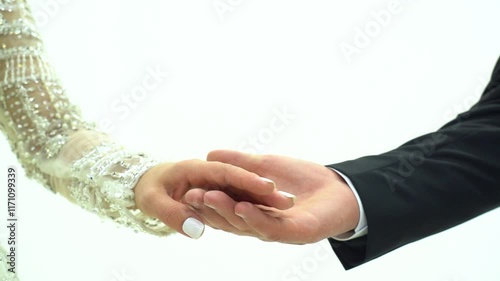 Bride and groom holding hands