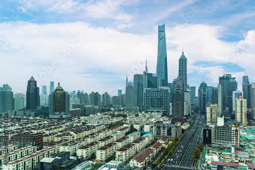 Obraz na płótnie Shanghai cityscapes, skyline, high rise skyscrapers office buildings and resident zone with blue sky and cloud in Shanghai city, China w salonie