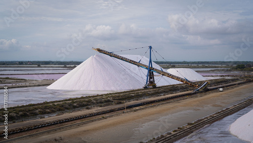 Saline lake harvesting, salt mountain photo