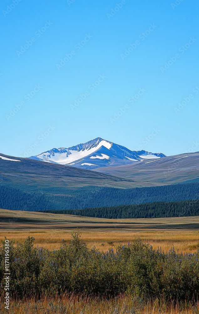 Fototapeta premium Majestic Snow-Capped Mountain Peak Dominates Serene Valley Landscape