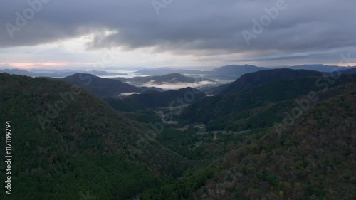 Aerial view of distant fog in mountain landscape of Fukuchiyama in Kyoto, Japan