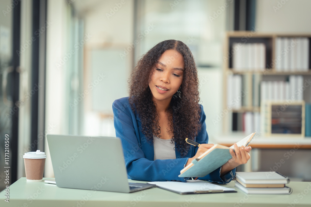 Female financial analyst working using a computer Surrounded by financial charts using digital tablet on table at home office and analyzing data documents Female financial analyst working using a computer Surrounded by financial charts using digital tablet on table at home office and analyzing data documents