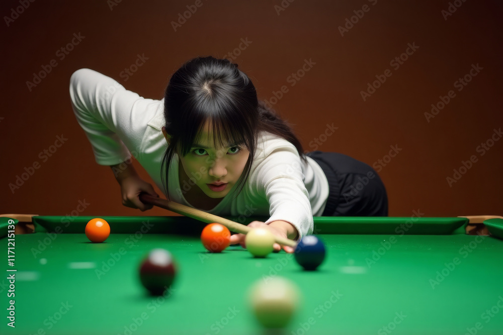 Fototapeta premium Pool Player in Action. Young woman in white sweater takes aim during game of pool, focused intently on colored balls on green felt table.