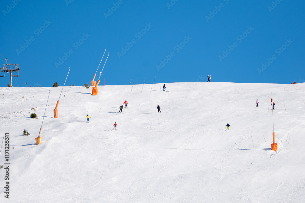 Skiers on the ski slopes in Andorra at Grandvalira in January 2025.