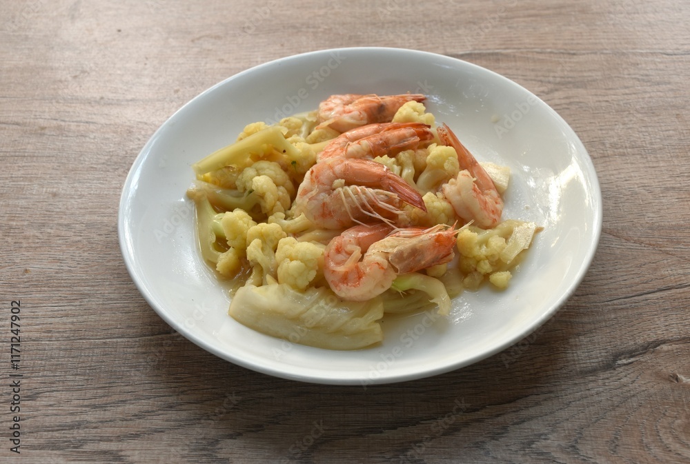 stir fried cauliflower with shrimp in soy sauce on plate stir fried cauliflower with shrimp in soy sauce on plate