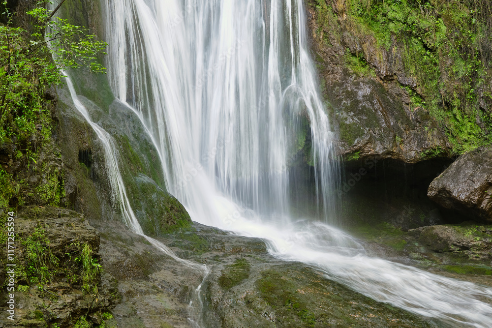 The Cascade d'Autoire waterfall in summer. A 30 meter high waterfall near Autoire in Lot Occitanie Southern France The Cascade d'Autoire waterfall in summer. A 30 meter high waterfall near Autoire in Lot Occitanie Southern France
