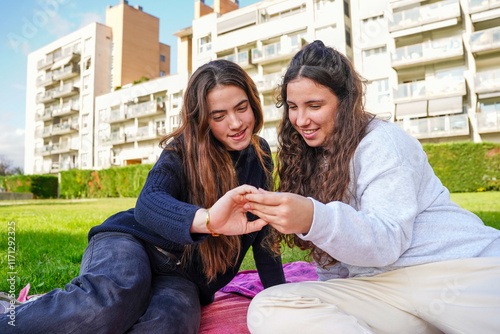 Romantic LGBTQ+ young women couple sharing a joyful moment outdoors photo